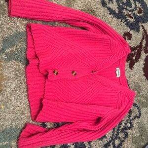 pink cardigan with black and brown marble buttons